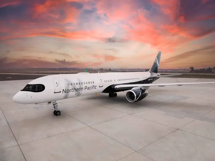 Northern Pacific aircraft on runway at sunset